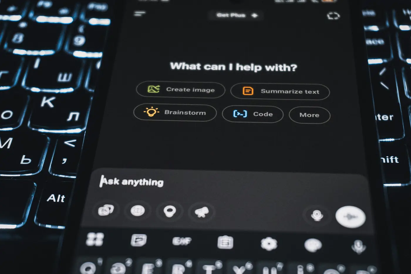 A phone screen showing an AI assistant ready to help with writing, coding and ideas